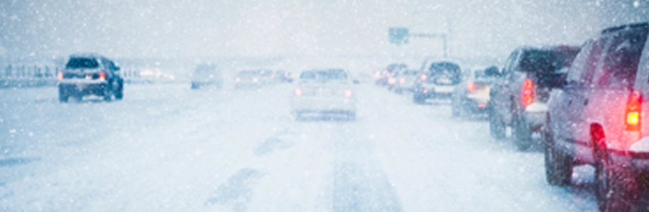Snow covered highway with traffic